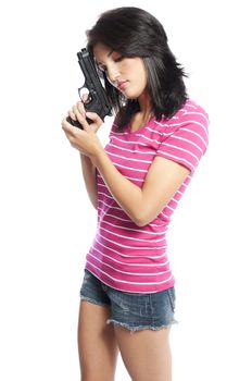 Attractive hispanic woman holding a hand gun on a white background