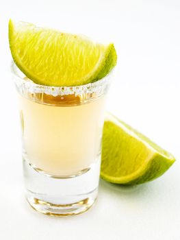 Shot of tequila and two slices of lime