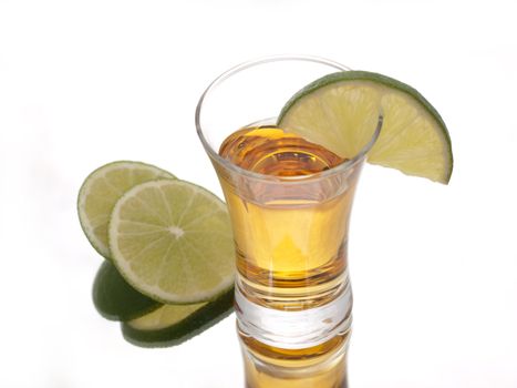 Golden tequila and green limes
