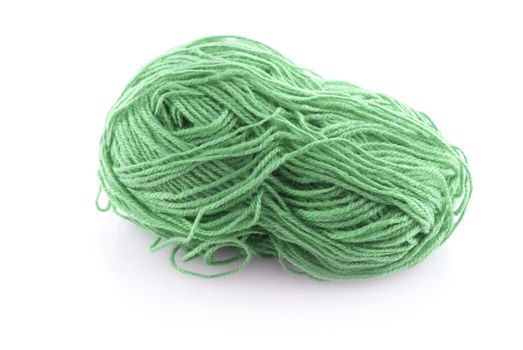 Green ball knitting wool or yarn isolated on white background.