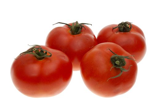 Four ripe tomatoes isolated on white background.
