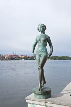 The statue on the river side of the Stockholm city hall