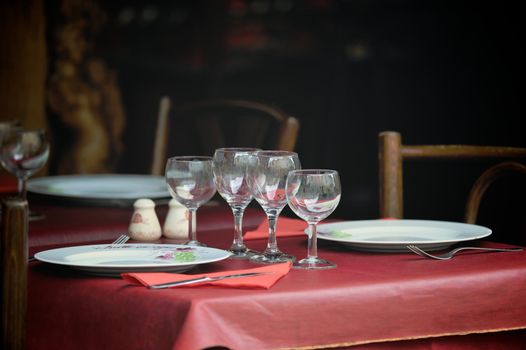 Table appointments in the bistro street. Photo with tilt-shift lens
