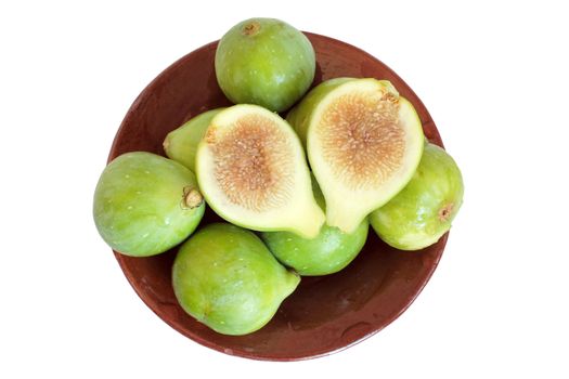 Green figs on plate in isolated over white