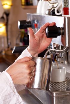 Operating a professional coffe machine in a cafe