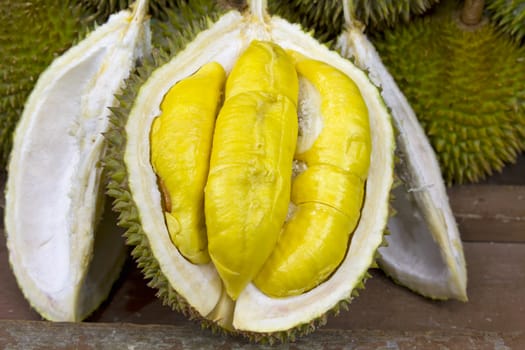  Durian open in display with yellow flesh on fruit stand in tropical country