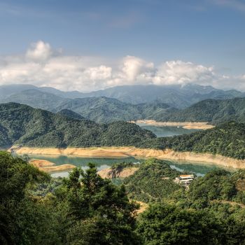 Landscape of lake in mountains with small building in Taiwan.