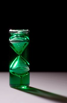 Running green crystal hourglass shot with backlight