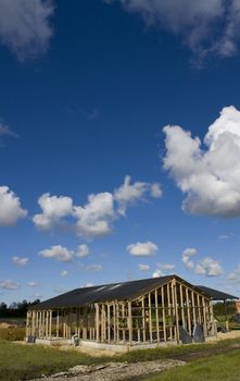 Wooden frame of a new house with blue sky