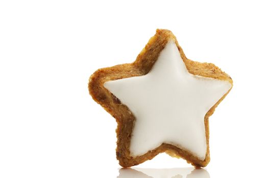 one star shaped cinnamon biscuit on white background