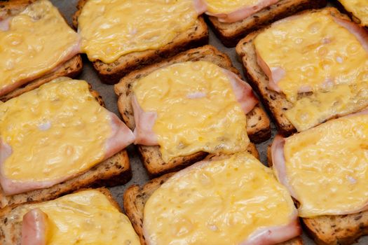 Toasts with cheese and ham