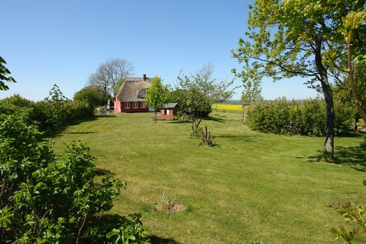 Traditional old classic decorative style Danish country thached roof  house home Denmark