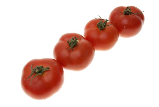 Four red tomatoes isolated on white background.