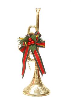 An isolated shot of a Christmas trumpet decoration.