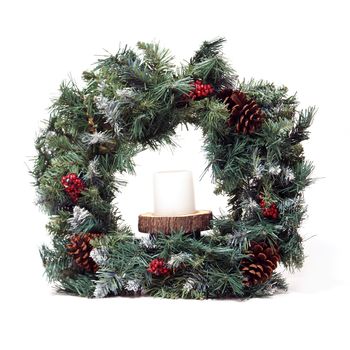 An isolated Christmas wreath decorated with pinecones and holly.