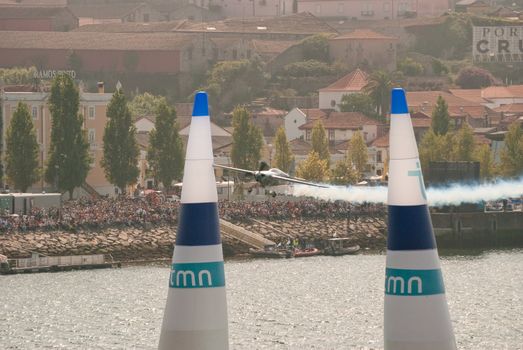 PORTO, PORTUGAL - SEPTEMBER 7: Hannes Arch (AUS) participates during the Red Bull Air Race event on September 12, 2009 in Porto, Portugal.