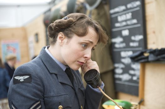 The woman in clothes English military a communications service provider of times of 40th years, taken on September 2011 on Goodwood revial in UK