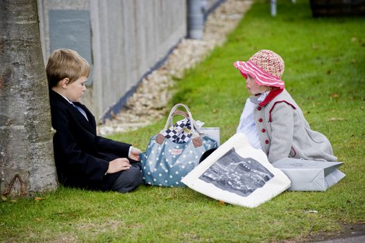 Two children in clothes of 50th years, taken on September 2011 on Goodwood revial in UK