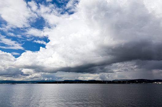 dramatic cloudscape in the harbor of Oslo Norway