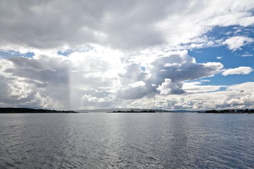 dramatic cloudscape in the harbor of Oslo Norway