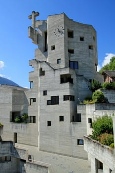 Modern catholic church of Saint-Nicolas in Heremence village by sunny day, Valais, Switzerland. It was built in 1960 - 1961 by architect Walter F�rderer and inaugurated in 1971.