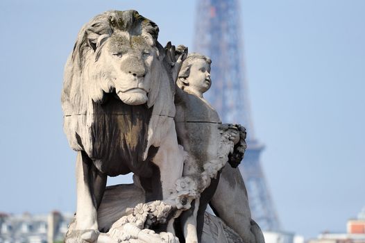 Statue of a lion on Alexander's bridge III. Photo with tilt-shift effect