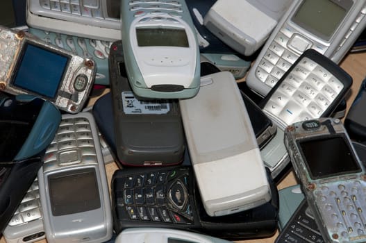 Many old mobile phone in a sort of graveyard