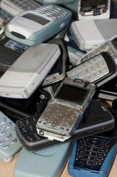 Close-up on an old mobile phones stack