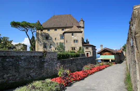Famous old castle in Yvoire, Haute-Savoie, France. It is situated in the famous Yvoire medieval village well known for its beautiful flower decoration during the summer season.
