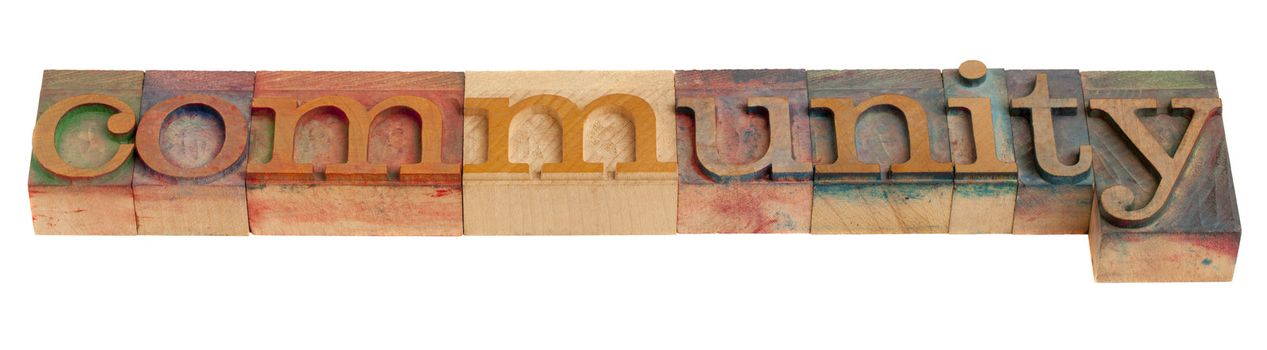 community - word in vintage wooden letterpress printing blocks, isolated on white