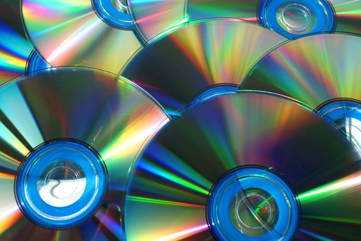 A group of CD or DVD Disks photographed close up.