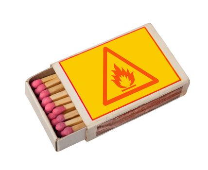 Yellow  matchbox with hazard sign isolated on white, clipping path.