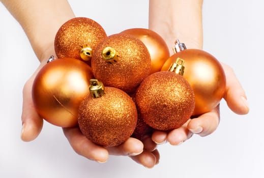 Female hands with Christmas spheres