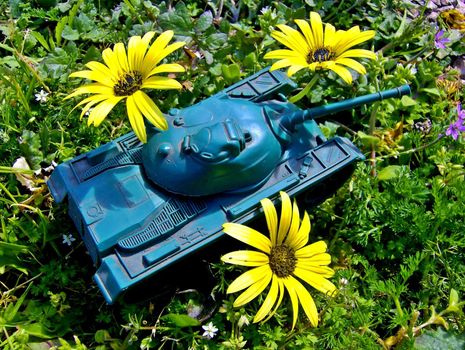Tank toy and yellow flowers!