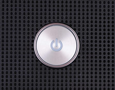Power button on metal hole background