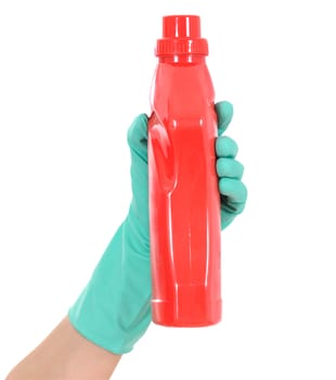 The hand in a green glove holds a red bottle
