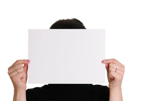 The woman holds empty sheet of paper isolated on white background