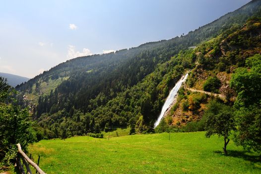 Big Waterfall With Rapids In The Italian Alps 