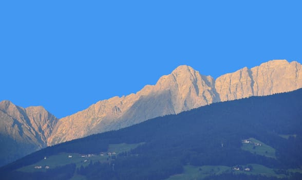 The Small Village High Up in the Alps in The Shadow Of Mountains