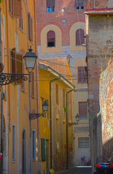 Narrow Alley With Old Buildings In Italian City of Pisa