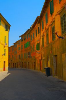 Narrow Alley With Old Buildings In Italian City of Siena