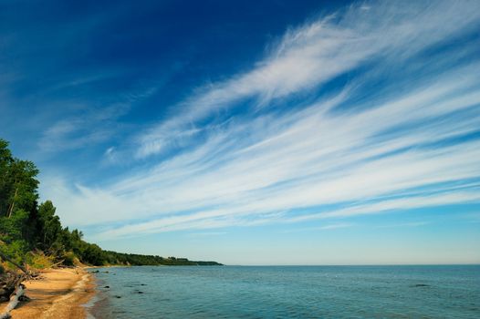 Azure airspace above the shore and sea level