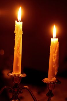 two candles on a candelabra