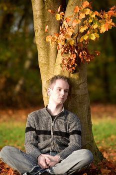 boy outside in autumn colors