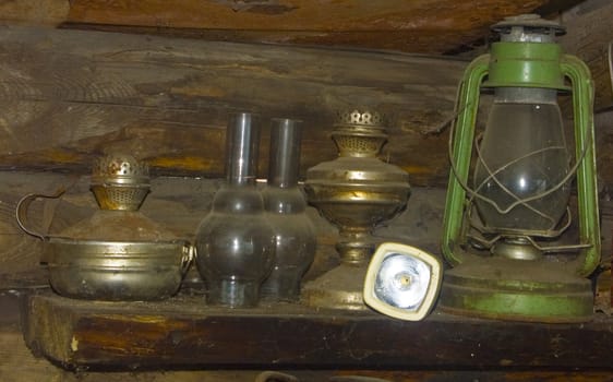 The image of three different kerosene's lamps and a small lamp