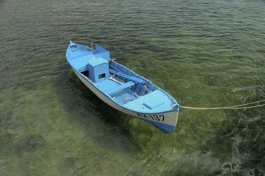 blue boat on harbor