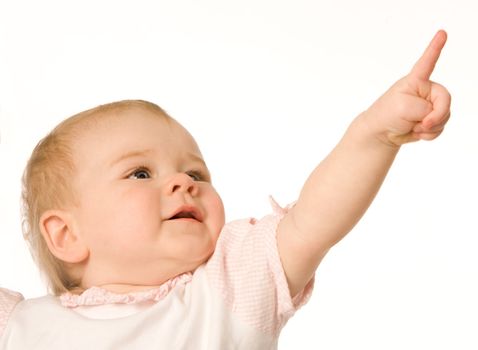 Small nice girl shows a finger upwards on a white background
