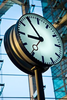 Round station watches with arrows close up
