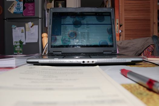 a laptop left idle with blank screen at a working from home setting