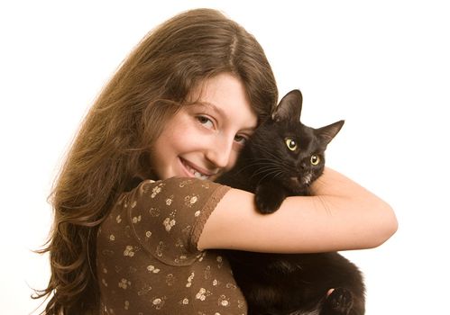 Girl with a black cat on a white background
